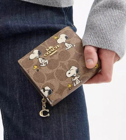 Coach X Peanuts Snap Wallet In Signature Canvas With Snoopy Print CBN32